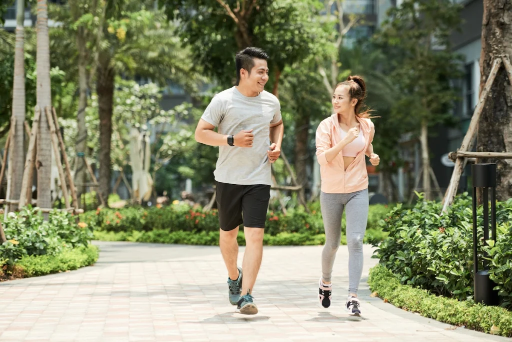 A couple are doing exercise - jogging at park.